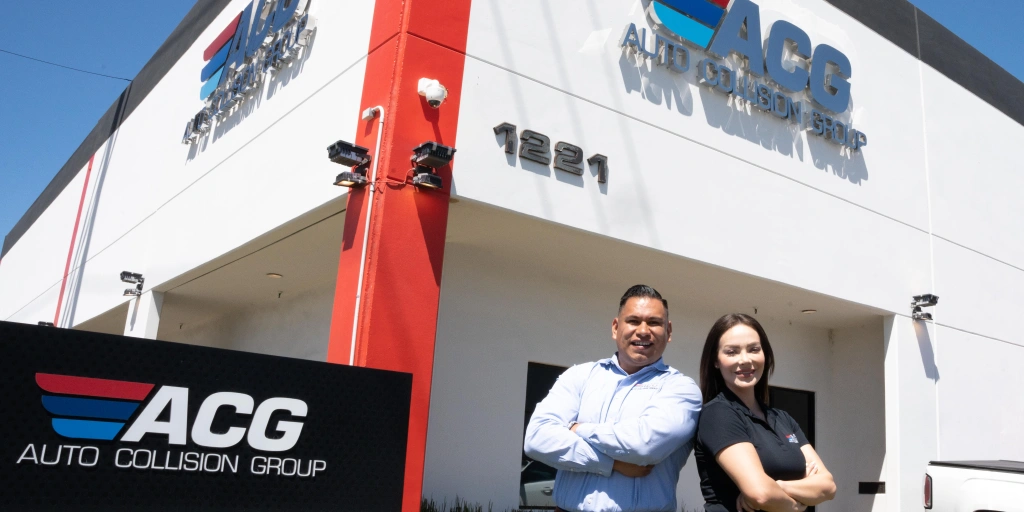 SBA 504 Refinance Rule Changes featured image, borrowers in front of their own building.